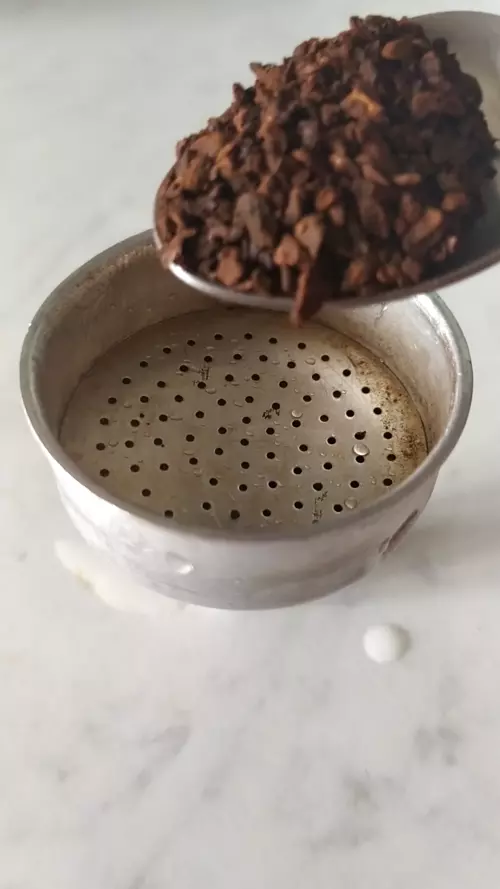 filter of a mocha filled half with chicory coffee root powder
